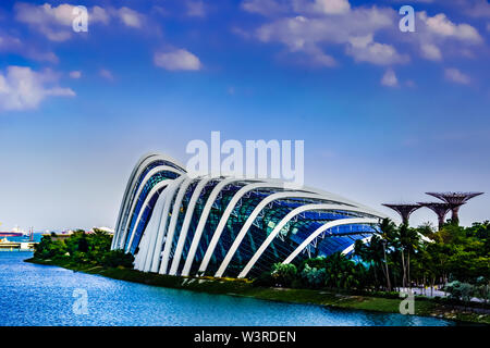 Singapore - Mar 15 , 2019: Gardens by the bay at Marine Bay with Flower Dome,  Cloud Forest, Supertree Grove and Marina Barrage in view, Singapore. Stock Photo