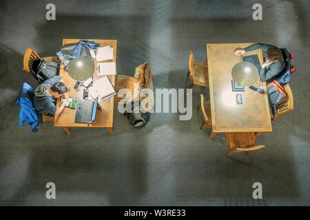 Calgary, Alberta, Canada - March 06, 2018:  two students study at a post secondary institution Stock Photo