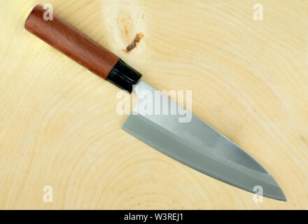 kitchen knife and wood butcher block countertop on white background Stock Photo