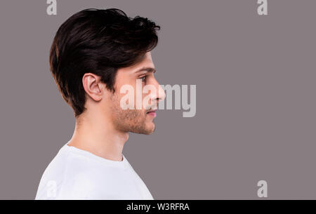 side profile of a handsome Caucasian male model wearing a tight Stock