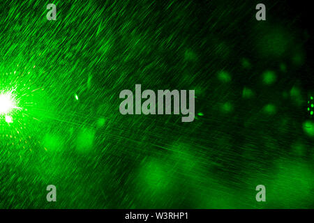 Camera lens flare by laser light create circles of objective iris shapes of number depending on number of lens surface and interference effect. Stock Photo