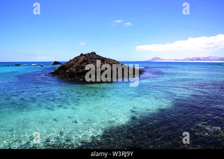 The bay of the fishing village of El Puertito on Isla de Lobos in Fuerteventura, Spain Stock Photo