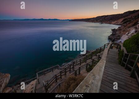 Beautiful shot of the ocean taken from the wooden staircase near the coast Stock Photo