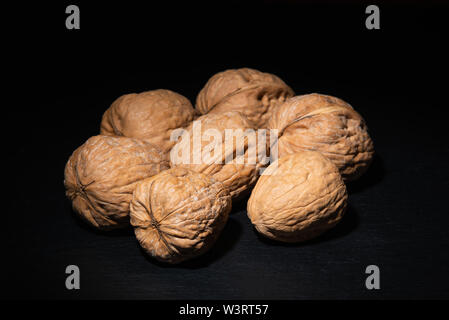 Delicious walnuts on black background Stock Photo