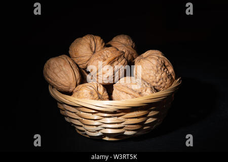 Delicious walnuts on black background Stock Photo