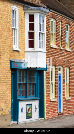 Terrace Housing and Colourful Tiled Butchers Shop Front Stock Photo