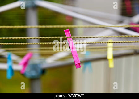 pink clothespin on drying rack in Umea Stock Photo