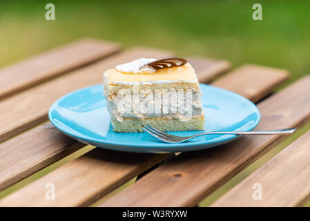 Cream nut cuts on a plate with a fork Stock Photo