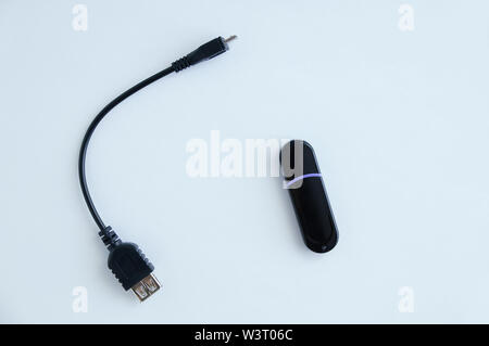 Cable otg for smartphone and flash drive. White background. Stock Photo