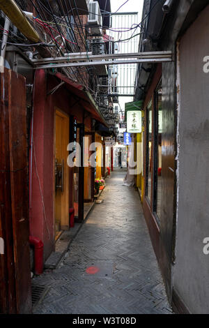 Shanghai, China - May 8 2019 : View of Tianzifang, a lot of small shops, cafes at alley with arts and crafts enclave Stock Photo