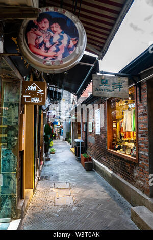 Shanghai, China - May 8 2019 : View of Tianzifang, a lot of small shops, cafes at alley with arts and crafts enclave Stock Photo