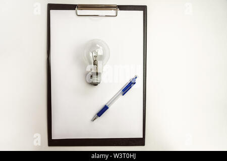Blank paper with an light bulb and pencil waiting for idea concept minimalist Stock Photo