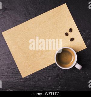 cup of coffee on a sheet of empty note paper Stock Photo