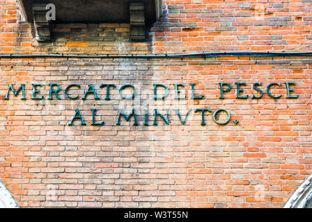 Venice, Italy - Sep 30, 2018: Historical Inscription on the building of the fish market in Venice Stock Photo