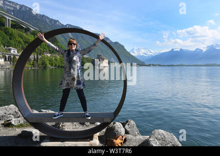 Tourists taking holiday photograph at Montreux on Lake Geneva in Switzerland