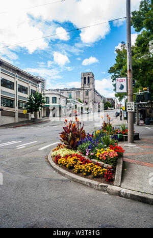 The Rialto Theater in Tacoma, Washington was designed by Roland E. Borhek to show movies.  View showing landscaping across and down the street. Stock Photo