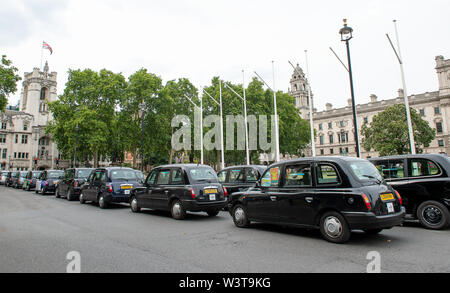 Taxi Driver Protest, Westminster Square, London, UK. 17th July, 2019. Taxi drivers brought Westminster and the the surrounding area to a halt this afternoon as part of their weekly protest by blocking the roads  around Parliament Square with their black cabs. TFL plan to stop taxi drivers from using some roads around London and London cabbies are not happy about it. Their message is 'Where buses go, taxis go'.  Credit: Maureen McLean/Alamy Live News Stock Photo
