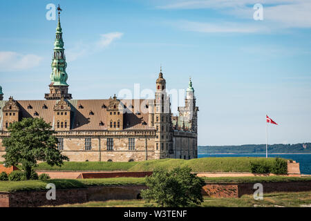 Kronborg Castle an the danish flag in Elsinore, Denmark, June 16, 2019 Stock Photo