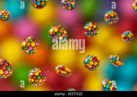 Reflection of smarties in drops of water Stock Photo