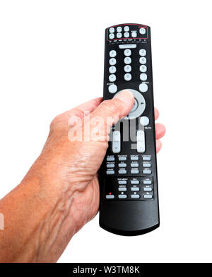 Vertical close-up shot of a woman’s hand holding a long black remote control on a white background. Stock Photo