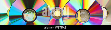 Piles of old and dirty CDs,DVD. Banner. Used and dusty disk Stock Photo