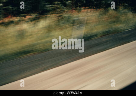 Motion blur looking out car window, background Stock Photo
