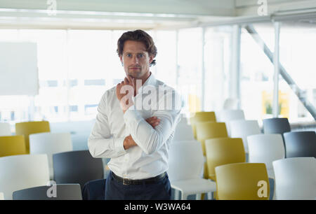 Businessman standing in the conference at modern office Stock Photo