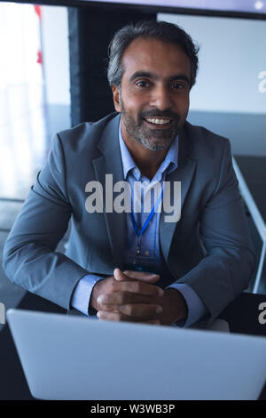 Businessman looking at camera in a business conference Stock Photo