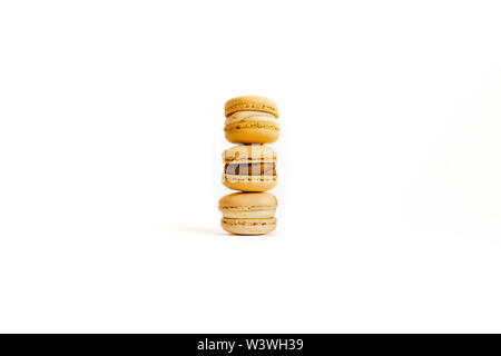 Three macaroons on an isolated background with space for your text. Stock Photo