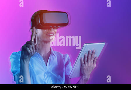 Composite image of female uses virtual reality headset Stock Photo