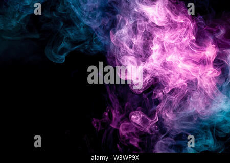 Cloud of pink and blue smoke on a black isolated background. Background from the smoke of vape Stock Photo