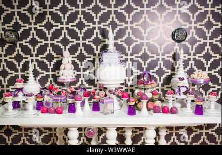 Candy bar. Table with sweets on the wedding day Stock Photo