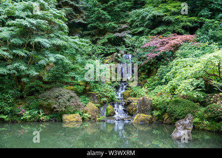 Inside a peaceful japanese garden, a Japanese pagoda rock statue in Portland, Oregon Stock Photo