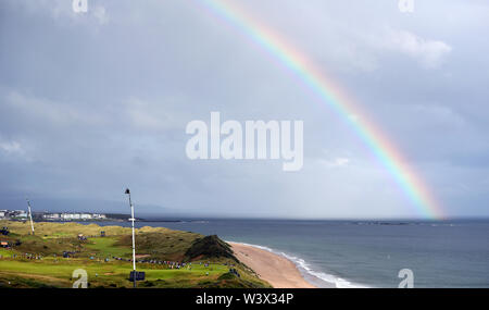 A rainbow appears over the course during day one of The Open Championship 2019 at Royal Portrush Golf Club. Stock Photo
