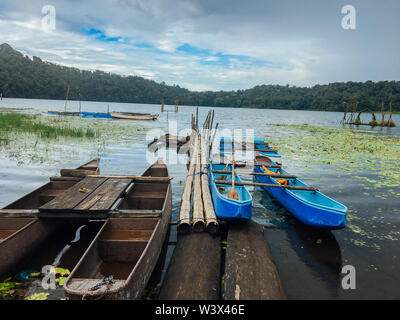 The traditional boats at Lake Tamblingan, Bali, Indonesia. Tamblingan is one the three lakes in Bedugul area Stock Photo