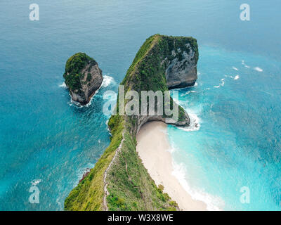 Aerial drone view of blue ocean view of seashore at Manta Bay or at Kelingking Beach on Nusa Penida Island, Bali, Indonesia Stock Photo