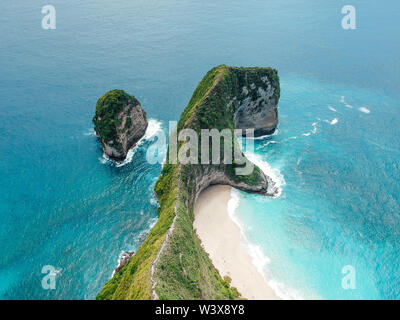 Aerial drone view of blue ocean view of seashore at Manta Bay or at Kelingking Beach on Nusa Penida Island, Bali, Indonesia Stock Photo