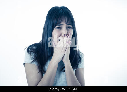 Close up of young woman feeling scared and shocked making fear, anxiety gestures. Looking terrified and desperate. People and Human expressions and em Stock Photo