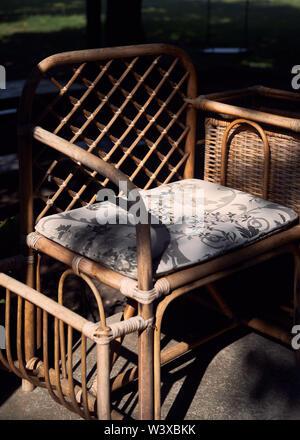 Old wicker arm chair Stock Photo