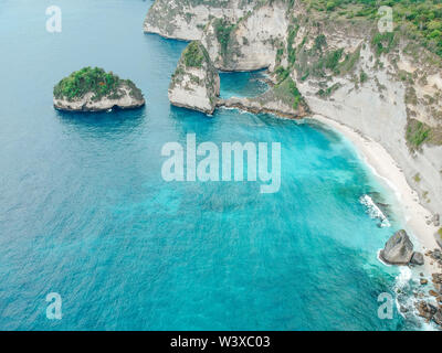 Aerial drone of diamond beach in Nusa Penida, Bali, Indonesia with amazing turquoise blue ocean. white cliff, ocean, rock, beach. Stock Photo