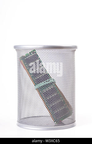 A stick of RAM in a metal trash can. Old memory sticks, wasting random access memory concept, unused or outdated PC components being thrown away Stock Photo