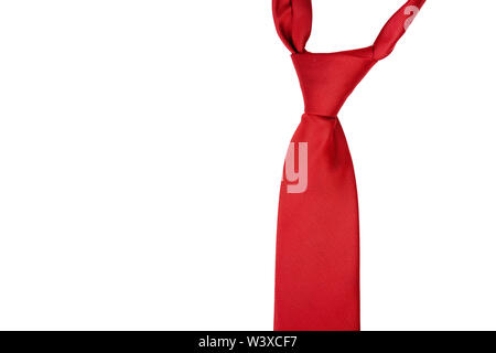 A classic red tie isolated on white background. Formal men clothes, suit elements and general red color concept, nobody Stock Photo