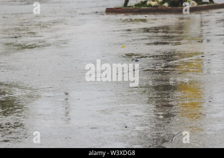 Rain falling down  outdoor on floor ground. Vintage tone Stock Photo
