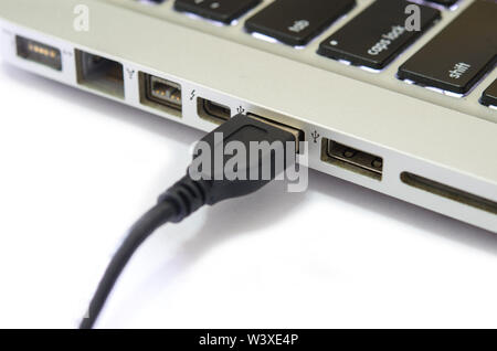 Plug in the USB computer laptop on white background. Stock Photo