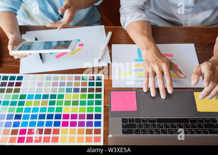 business technology concept, creative team designer choosing samples with UI/UX developing on sketch layout design mockup on smartphone application fo Stock Photo