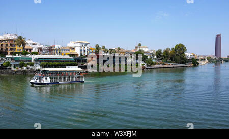 The Guadalquivir river running through Seville, Spain. Stock Photo