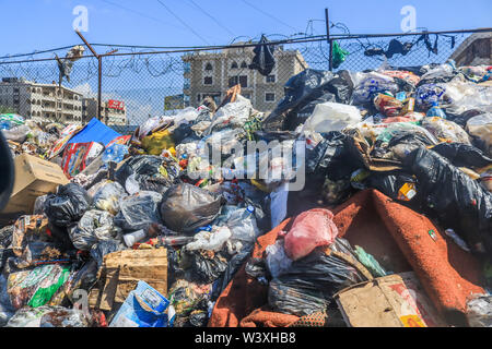 Beirut Lebanon. 18th July 2019. Uncollected garbage left outside  Sabra refugee camp housing thousands of Palestinian refugees in Beirut after Palestinians in Lebanon  protested against a government crackdown on unlicensed workers and cheap labour and on businesses hiring foreign workers without permit Credit: amer ghazzal/Alamy Live News Stock Photo