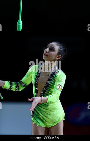Zohra Aghamirova from Azerbaijan performs her clubs routine during 2019 Grand Prix de Thiais Stock Photo