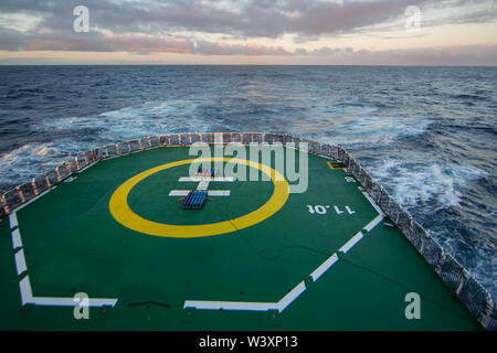 A research vessel conducts a scientific oceanographic cruise in the South Atlantic Ocean. Stock Photo