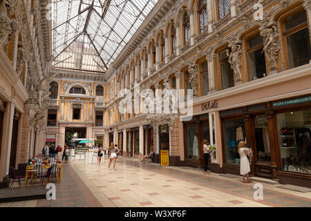 Ukraine, Odessa, Deribasivska Street, 12th of June 2019. The late 19th century shopping passage covered with a metal and glass canopy Stock Photo